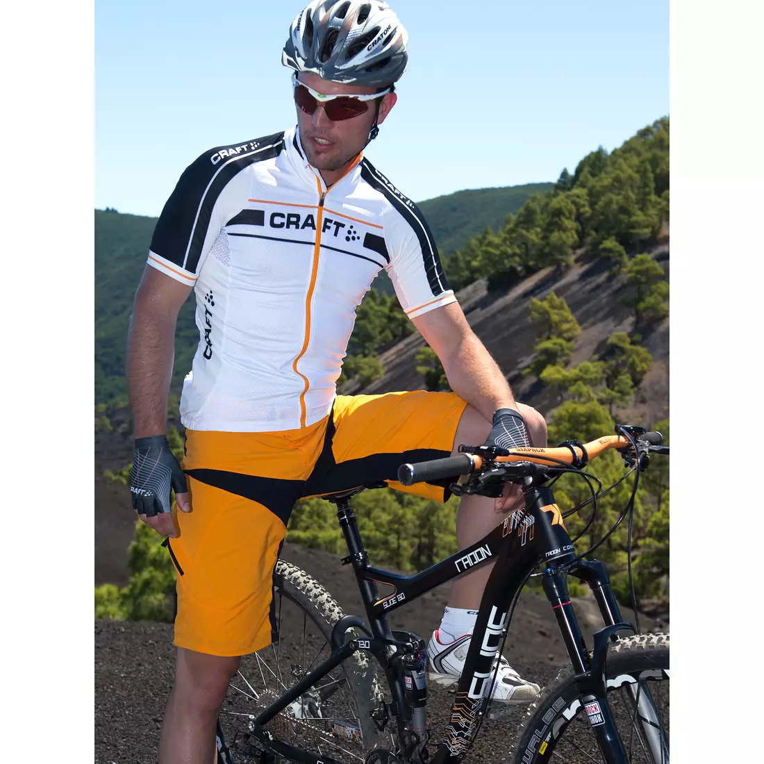 CRAFT Performance Bike Loose Fit pánske cyklistické šortky 1900683-2560, farba: oranžová